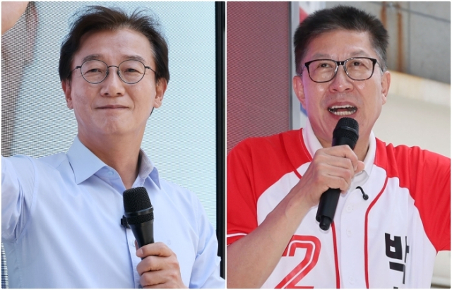 더불어민주당 전재수 후보가 1일 오후 부산 동구 범일동에서 지지자들과 기념사진을 찍고 있다. 같은 날 국민의힘 박형준 부산시장 후보가 부산 영도구 봉래시장 인근에서 지지를 호소하고 있다. 정종회 기자 jjh@
